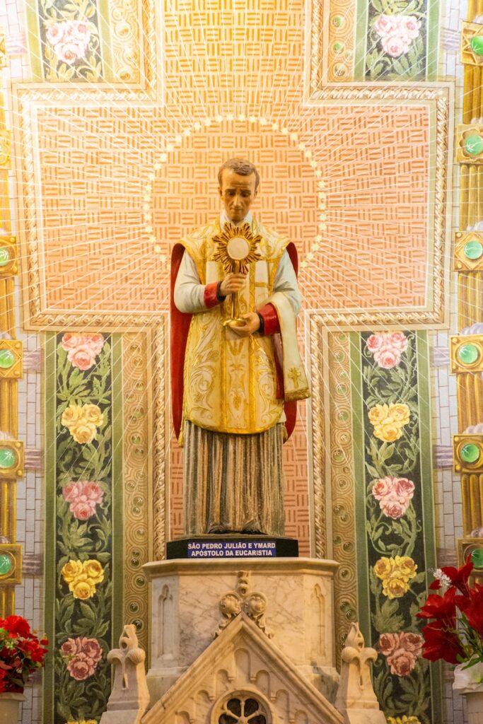 woman in red and gold dress figurine